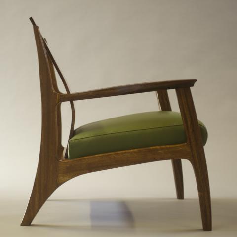 Lounge chair with contemporary shaping and a cushion seat